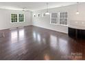 Spacious living room with hardwood floors and an abundance of natural light at 1680 Trentwood Dr, Fort Mill, SC 29715