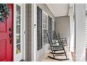 Inviting front porch with rocking chairs and classic home details at 175 Turnberry Ln, Mooresville, NC 28117