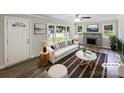 Bright living room with fireplace, modern furnishings, and large windows at 2136 W 6Th Ave, Gastonia, NC 28052
