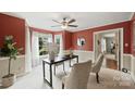 Cozy office space featuring a ceiling fan, neutral carpet, large windows, and decorative accents at 2525 Saddlehorse Ln, Gastonia, NC 28056