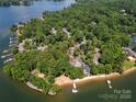Beautiful lakefront neighborhood offering tranquil living with mature trees, a private beach, and boat docks at 26 New River Trce, Lake Wylie, SC 29710