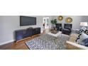 Bright and airy living room with modern furniture, decor, and hardwood floors at 3800 Lovett Cir, Charlotte, NC 28210