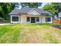 Inviting home showcasing a well-manicured front lawn and a covered porch at 520 E Main St, Dallas, NC 28034