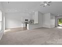Expansive living room featuring an eat-in kitchen area, ideal for modern living and entertaining at 5314 Upton Pl, Charlotte, NC 28215