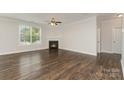 Bright living room with a cozy fireplace, hardwood floors, and ample natural light at 732 Altamonte Dr, Clover, SC 29710