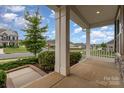 Inviting porch with decorative columns and landscaping, offering a relaxing outdoor space at 732 Altamonte Dr, Clover, SC 29710