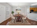 Bright dining room boasts stylish decor and a large window at 10446 Trolley Run Dr, Cornelius, NC 28031