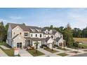 New townhomes featuring craftsman-style architecture, attached garages, and professional landscaping at 12016 Basking Dr, Charlotte, NC 28214