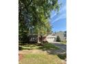 Charming two-story home with a well-manicured lawn, mature trees, and a two-car garage at 1304 Ridge Haven Rd, Waxhaw, NC 28173
