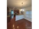 Open-concept kitchen with stainless steel appliances and granite countertops at 1304 Ridge Haven Rd, Waxhaw, NC 28173
