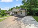 Charming home with a well-manicured lawn and inviting front porch at 144 Walnut St, Chester, SC 29706