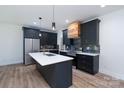 Modern kitchen boasting an island, stainless steel appliances, and contemporary fixtures at 1528 Enochville Rd, Kannapolis, NC 28081