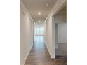 Inviting hallway showcasing hardwood floors, leading to a bright living space with natural light at 2070 Skyhawk Dr, York, SC 29745