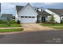 Well-maintained home with 2-car garage, dormer windows, and landscaped front yard at 25952 Appleyard Ct, Lancaster, SC 29720