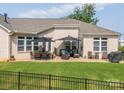 Backyard features a fenced yard and a patio area with outdoor seating and a grill, perfect for entertaining at 3006 Constitution Ln, Gastonia, NC 28056