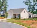 Stylish home with manicured lawn, black fencing and a cozy back patio at 3006 Constitution Ln, Gastonia, NC 28056