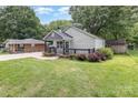 Inviting home featuring well-kept lawn and classic architectural details at 403 Weaver St, Cherryville, NC 28021