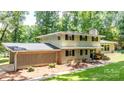 Charming two-story home with brick accents, a landscaped yard, and a welcoming front porch at 411 Saint Andrews Rd, Statesville, NC 28625