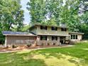 Inviting two-story home with well-maintained lawn and brick accents at 411 Saint Andrews Rd, Statesville, NC 28625
