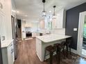 Contemporary kitchen featuring stainless steel appliances and a stylish breakfast bar at 411 Saint Andrews Rd, Statesville, NC 28625