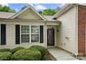 A close up of the front entrance with clean design and a well maintained lawn at 4510 Glenlea Commons Dr, Charlotte, NC 28216