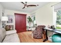 Bright bedroom with hardwood floors, a ceiling fan, and a charming wardrobe at 7526 Shadowstone Dr, Charlotte, NC 28270