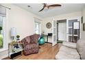 Inviting bedroom featuring hardwood floors, natural light, and access to the hallway at 7526 Shadowstone Dr, Charlotte, NC 28270