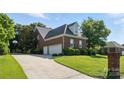 Spacious attached garage with ample parking space and a well-manicured lawn, adding convenience and appeal at 104 Fairwind Ct, Fort Mill, SC 29708