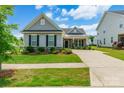 Charming single Gathering home with a manicured front lawn at 174 Pine Eagle Dr, Rock Hill, SC 29732