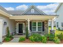 Front porch of a single Gathering home with brick and stone accents at 174 Pine Eagle Dr, Rock Hill, SC 29732