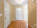 Welcoming foyer features wood floors and neutral walls leading into the home's living space at 2363 Sanderling Dr, Rock Hill, SC 29732
