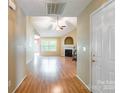 Inviting foyer featuring wood flooring, a view of the living room, and neutral color palette at 2363 Sanderling Dr, Rock Hill, SC 29732