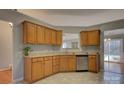 Spacious kitchen featuring oak cabinets, granite countertops, and stainless steel appliances at 2712 Thornburg Ct, Monroe, NC 28110