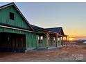 New construction home under development with covered front porch and in a rural setting at 3000 Paul Payne Store Rd, Taylorsville, NC 28681