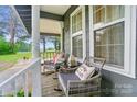 Cozy front porch adorned with rocking chairs and decorative pillows provides a welcoming outdoor seating area at 3810 Biggers Rd, York, SC 29745