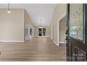 Bright living room with wood-look floors, neutral paint, and ample natural light at 5916 Cashion Rd, Huntersville, NC 28078