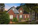 Traditional brick home with lush landscaping at 765 Portpatrick Pl, Fort Mill, SC 29708