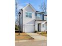 Attractive two-story home showcasing light gray siding, a one-car garage, and a well-maintained front lawn at 9142 Widden Way, Charlotte, NC 28269
