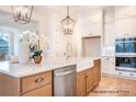 Bright kitchen features an island, pendant lighting, stainless appliances, and ample cabinet space at 1059 Sage Pine Cir, Clover, SC 29710