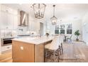 Bright kitchen features an island, pendant lighting, stainless appliances, and ample cabinet space at 1059 Sage Pine Cir, Clover, SC 29710