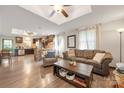 Open-concept living space featuring hardwood floors, modern decor, and seamless flow to the kitchen at 1116 S Juniper St, Kannapolis, NC 28081
