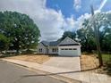 Inviting single-story home with a driveway and a well-maintained lawn and street view at 1312 W Monroe Rd, Salisbury, NC 28144