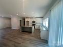 Bright kitchen with white cabinets, granite countertops, stainless steel appliances, and hardwood floors at 1312 W Monroe Rd, Salisbury, NC 28144