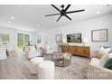 Bright and airy living room with modern furnishings, a ceiling fan, and an open floor plan perfect for entertaining at 1312 W Monroe Rd, Salisbury, NC 28144