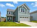 Charming two-story home with a well-maintained lawn, inviting porch, and a two-car garage at 133 Aspire Cir, Wingate, NC 28174