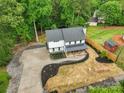 Beautiful aerial view of a modern farmhouse with fresh landscaping and long driveway at 136 Digh Cir # 4, Mooresville, NC 28117