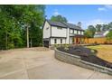 Stunning two-story home with a modern design, black roof, and welcoming front porch at 136 Digh Cir # 4, Mooresville, NC 28117