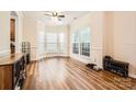 Bright living space with wood floors and large windows at 13820 Cypress Woods Dr, Huntersville, NC 28078