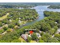 Aerial view of property at 2004 Marquesas near Lake Wylie surrounded by mature trees and other homes at 2004 Marquesas Ave, Tega Cay, SC 29708