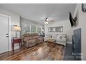 Bright living room with hardwood floors, comfortable seating, and a modern fireplace at 309 Ackert Ave, Salisbury, NC 28144